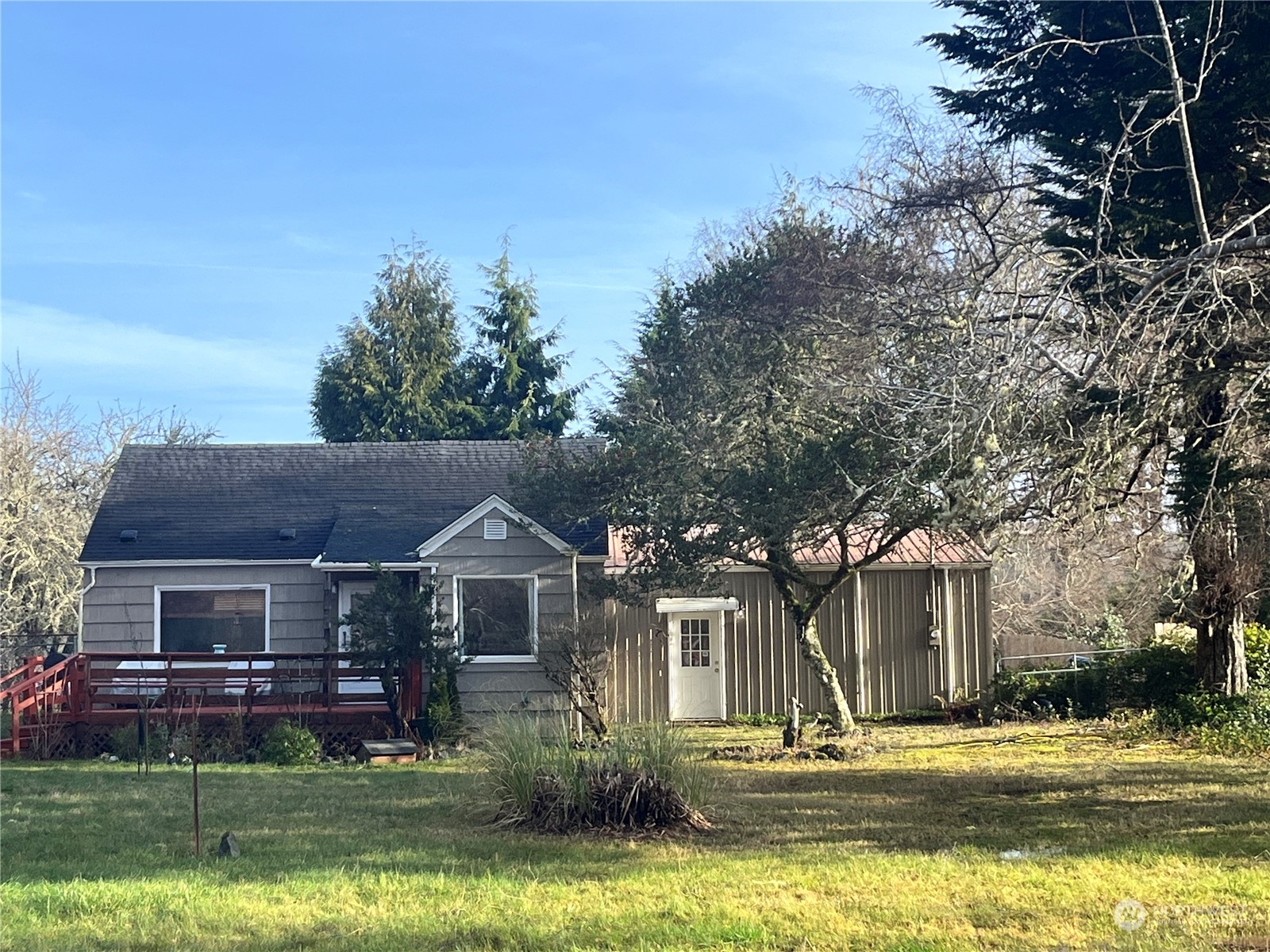 a front view of house with yard and green space