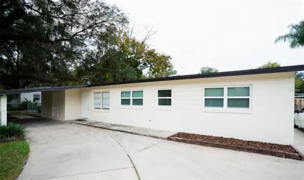 a house with trees in the background