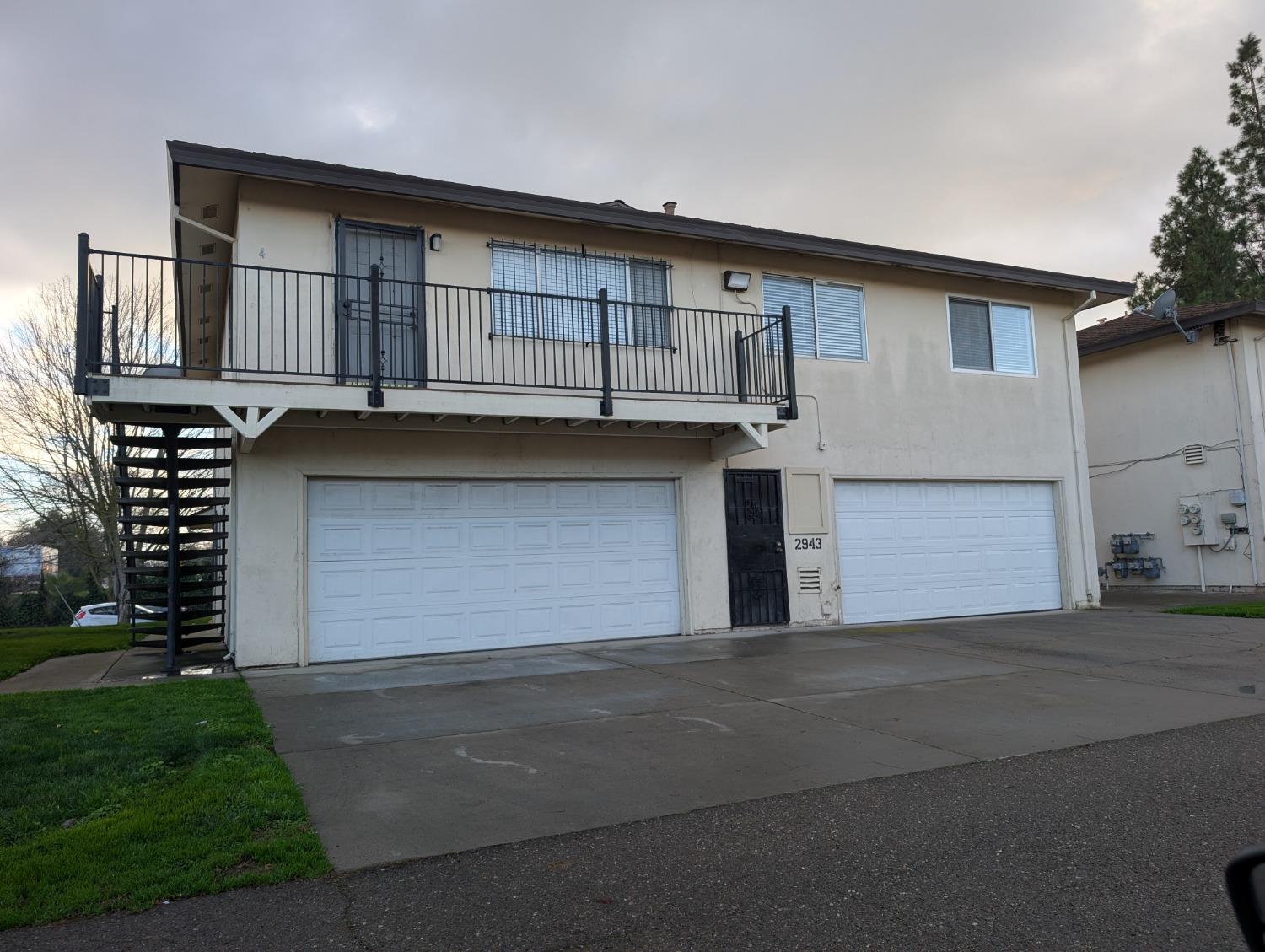 a front view of a house with a garage