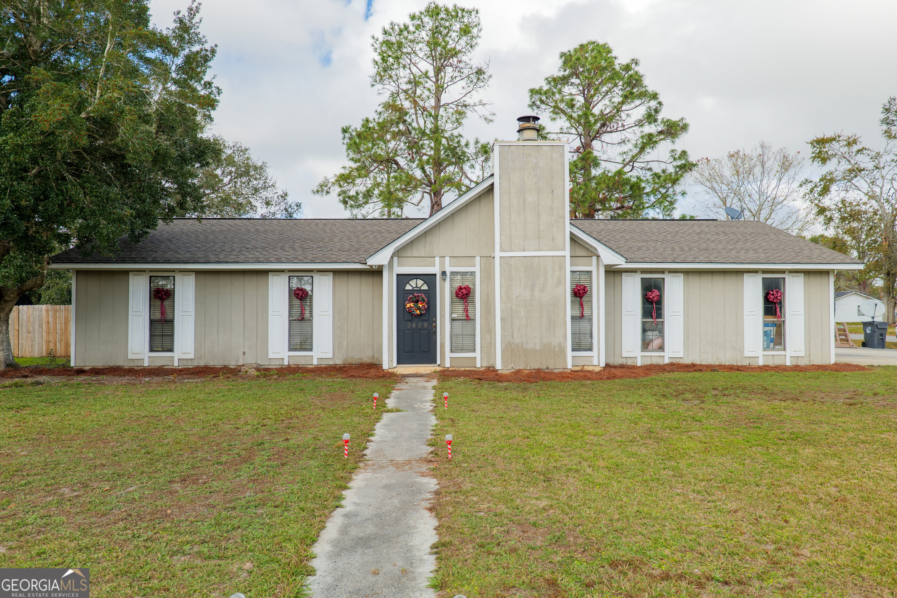 front view of a house with a big yard