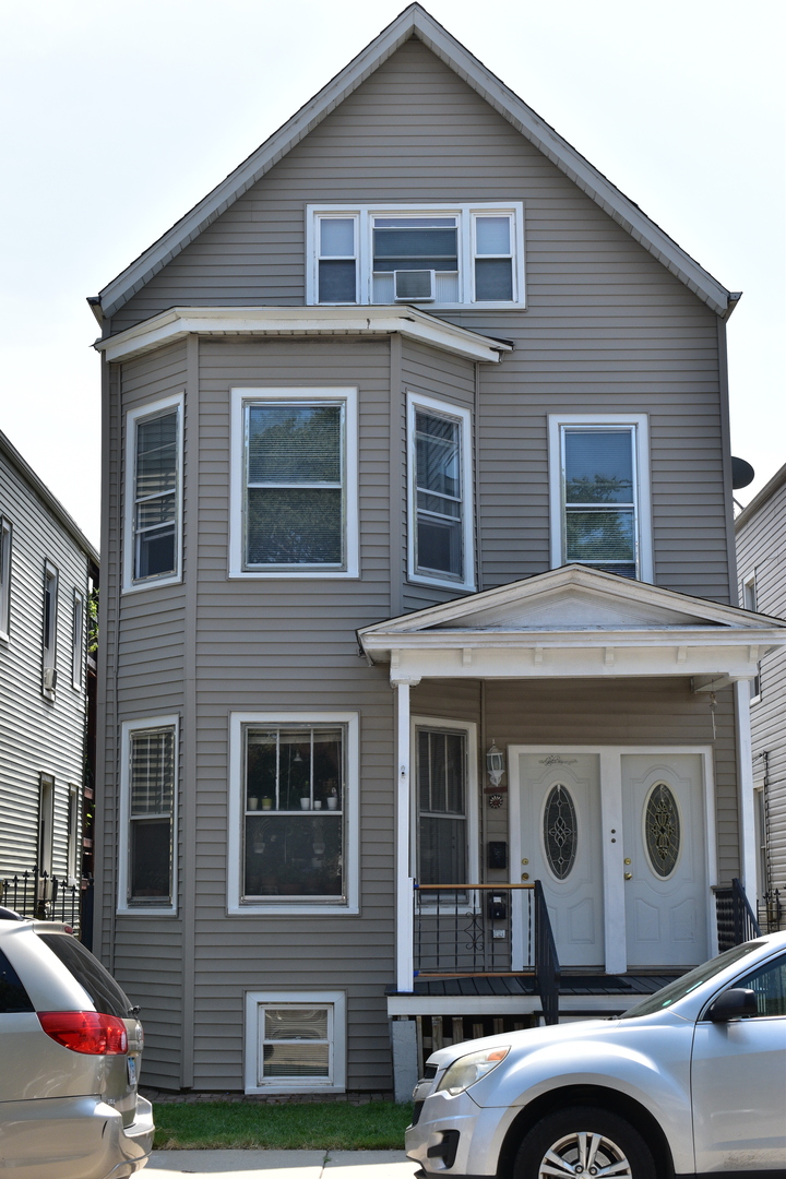 a front view of a house with a garage