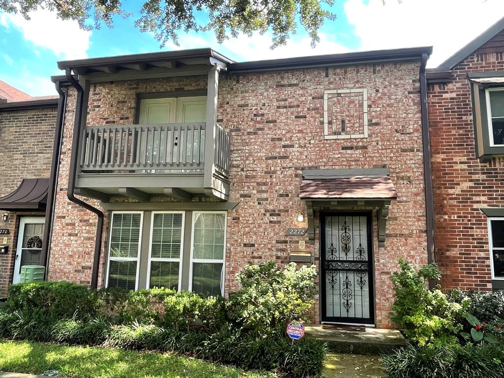 Front of the unit with balcony from the primary bedroom