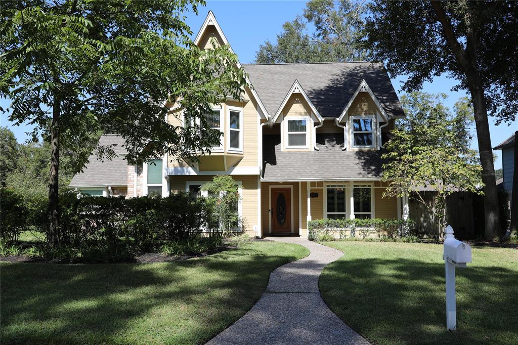 a view of house with yard