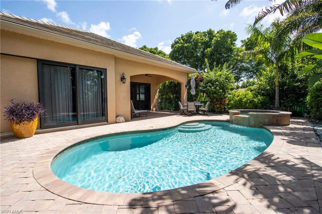 a view of a swimming pool with a patio