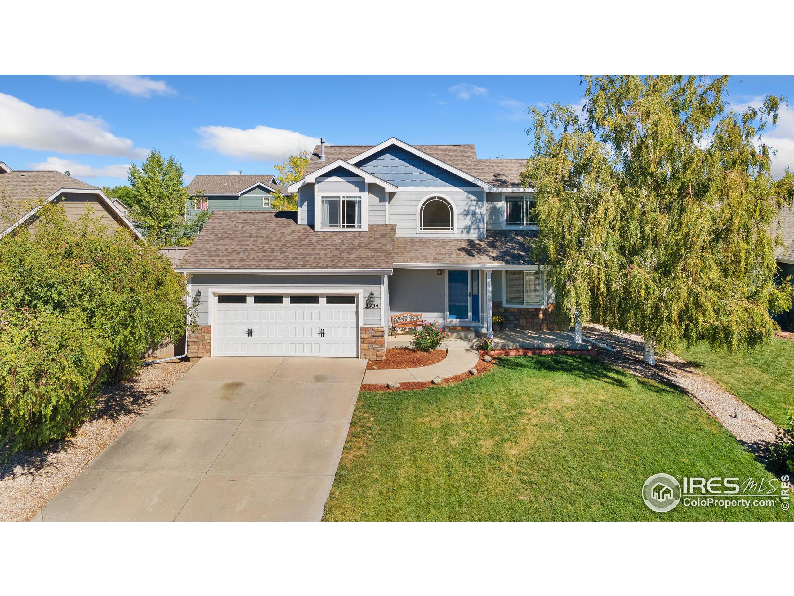 a picture of a house with swimming pool and a yard