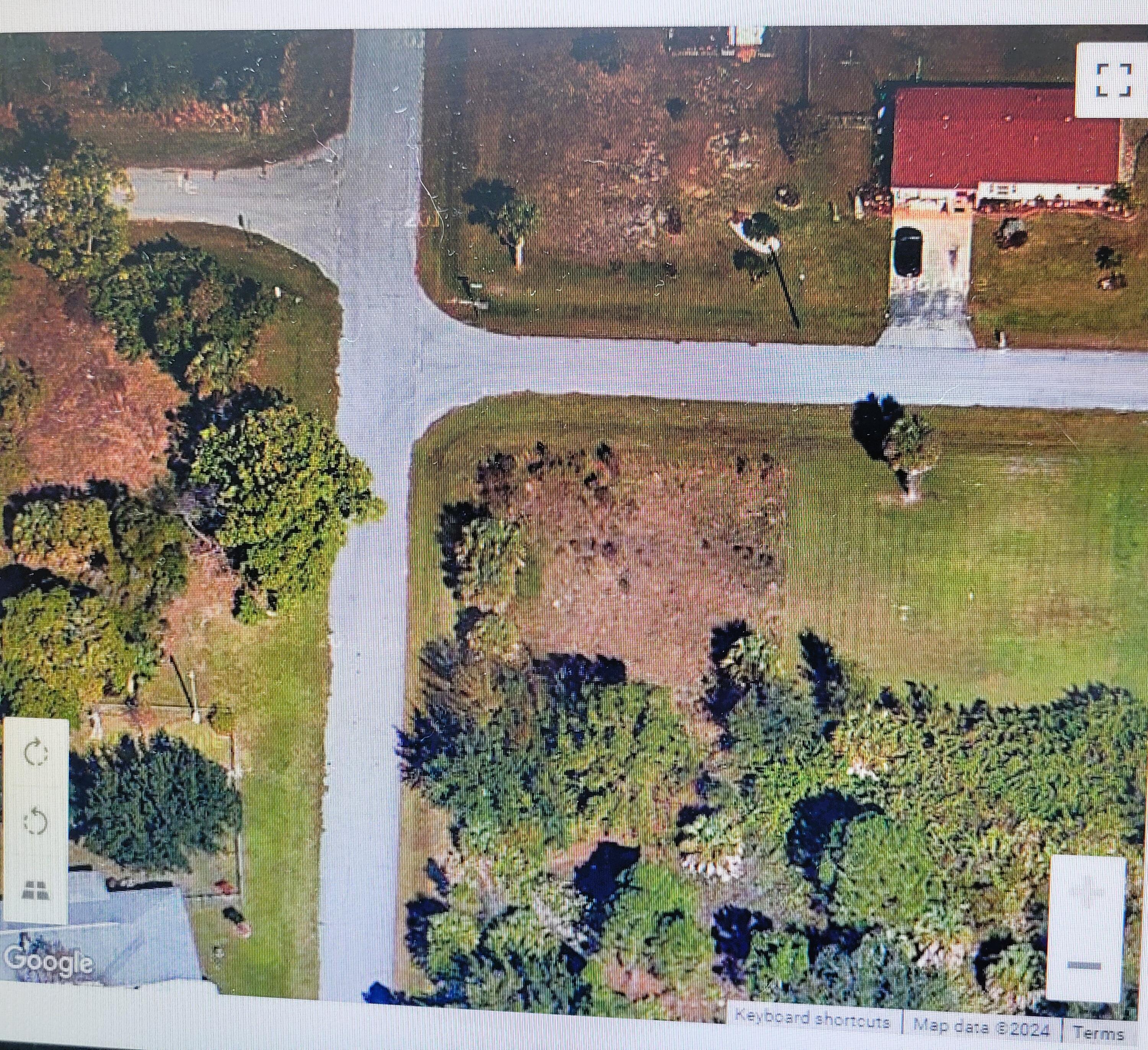 an aerial view of a house with outdoor space