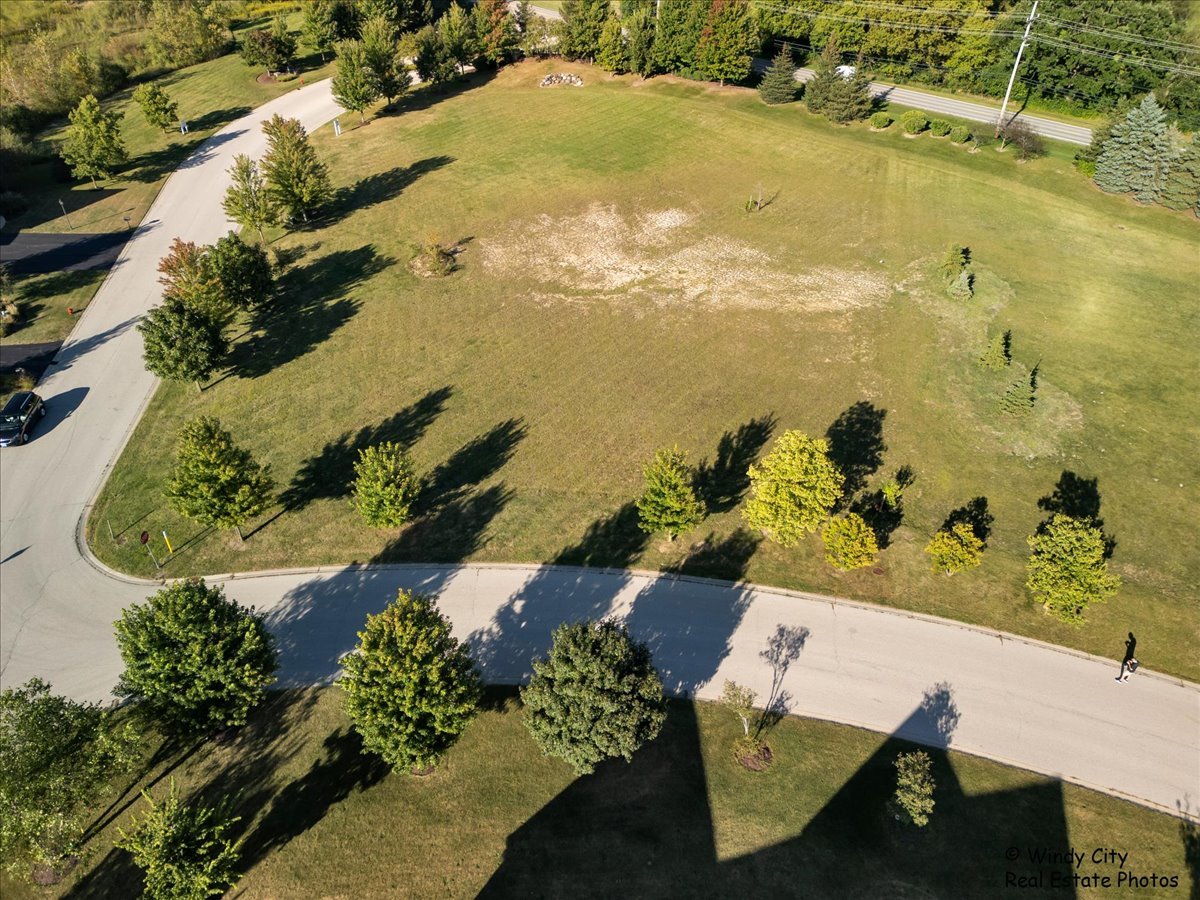 an aerial view of swimming pool with a yard