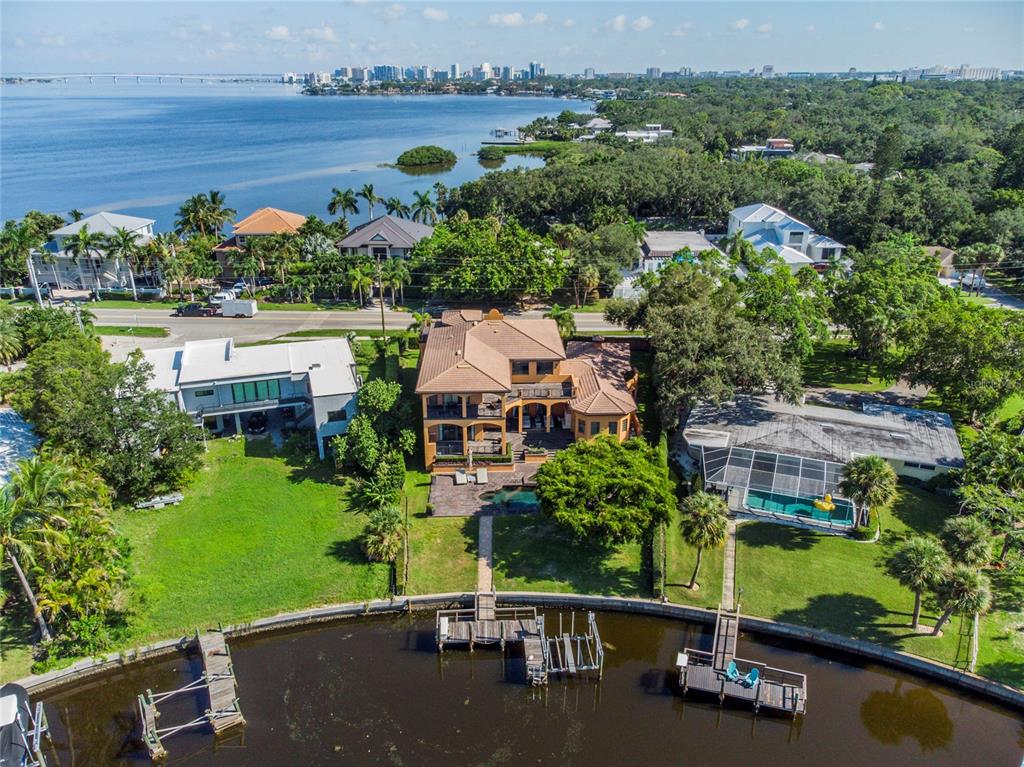 an aerial view of a house with a yard outdoor seating and yard