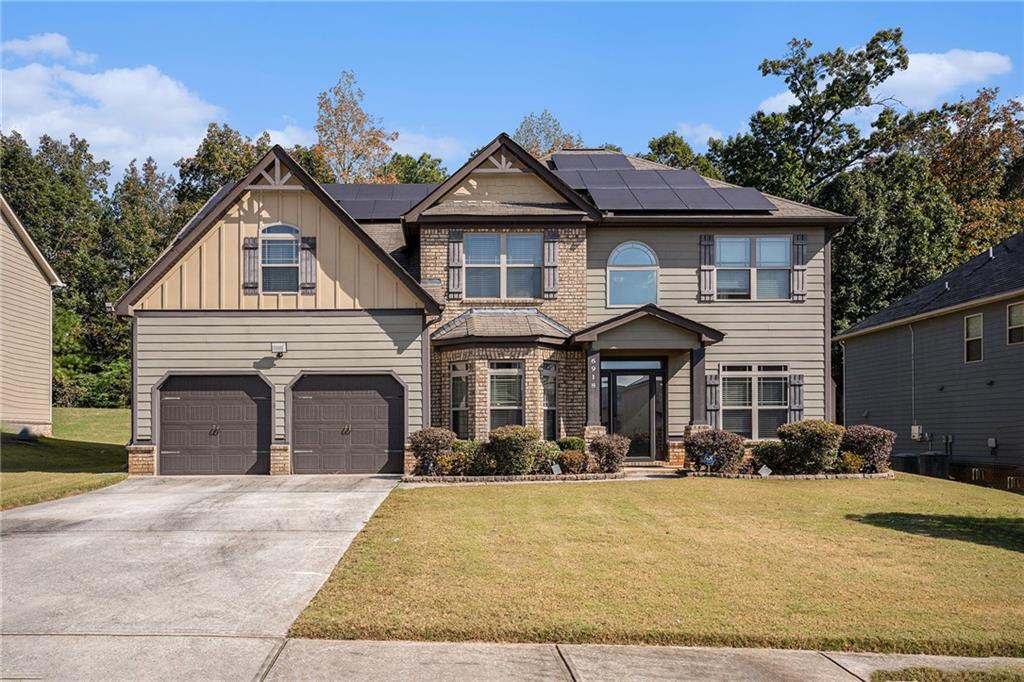 a front view of a house with a yard