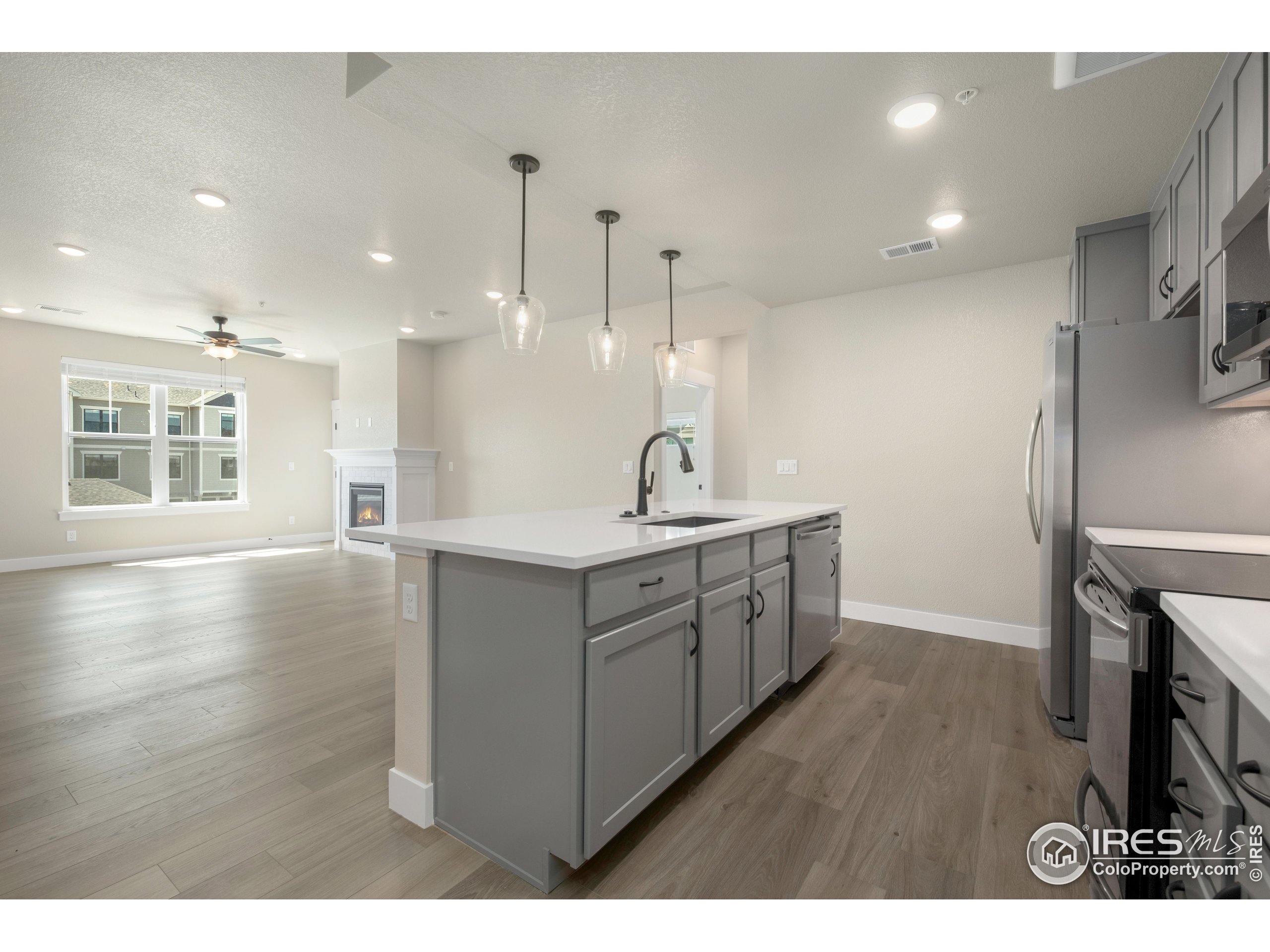 a bathroom with a sink a vanity and a large mirror