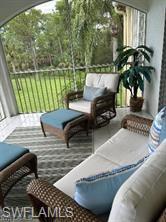 a view of a balcony with furniture