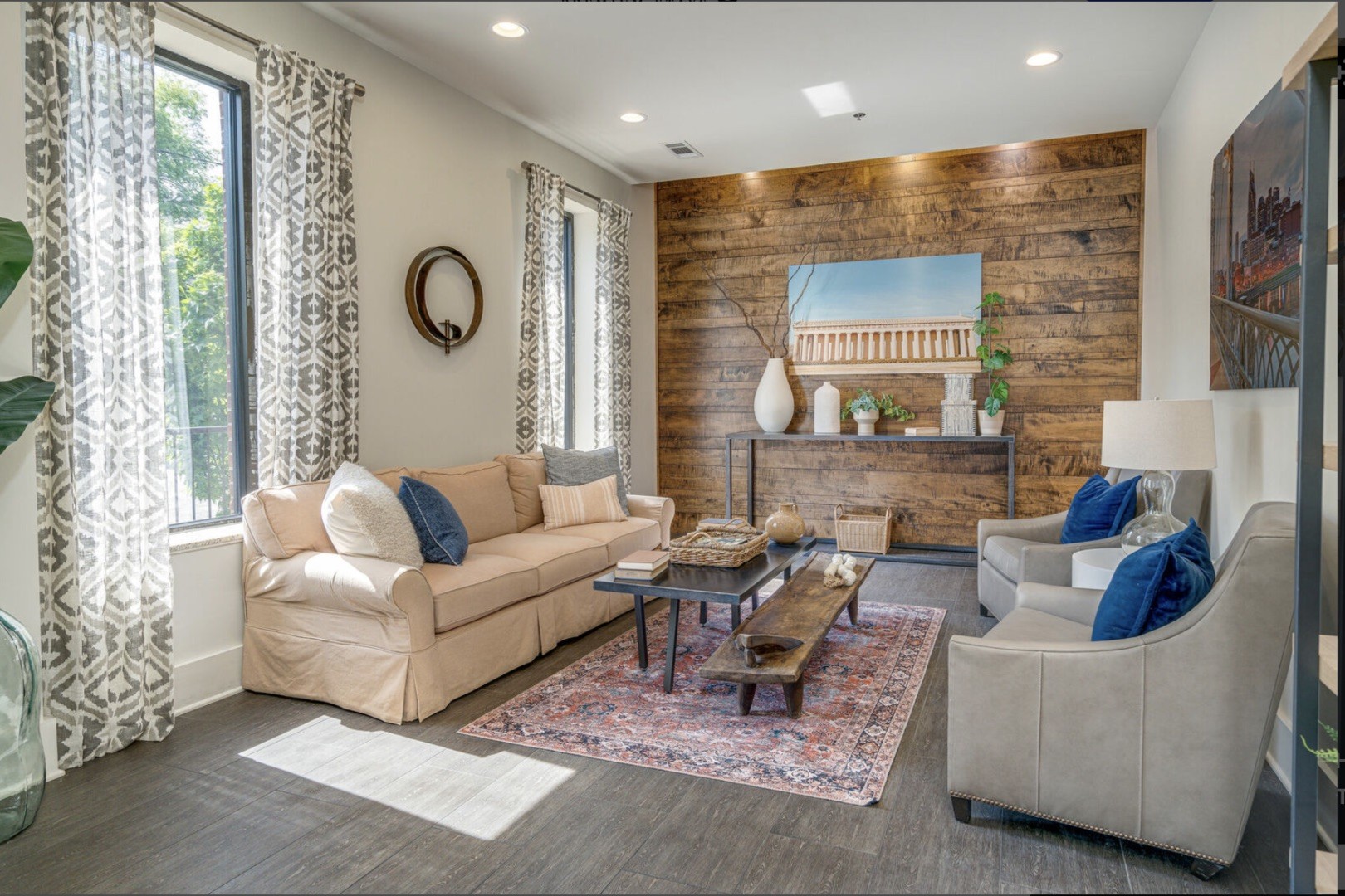 a living room with furniture and a large window