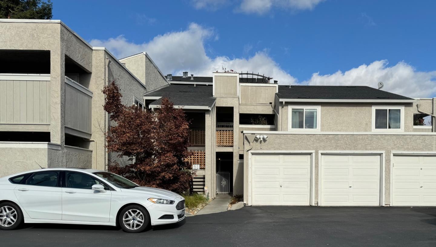 a view of a car parked in front of a house