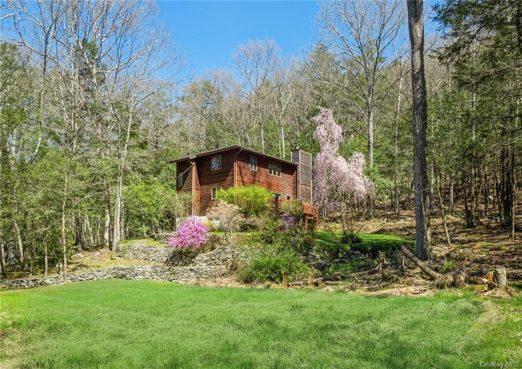 a garden with trees in front of it