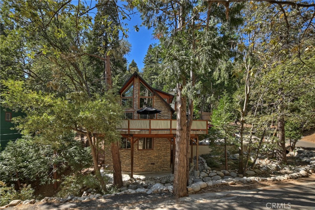 a front view of a house with trees