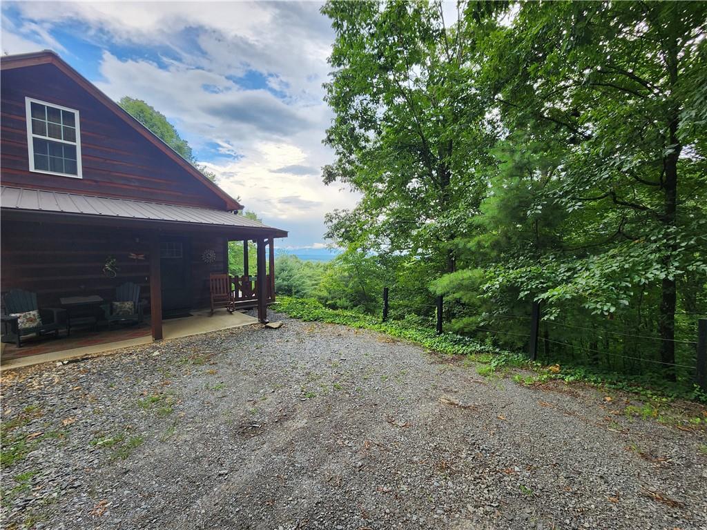 a view of a house with a backyard