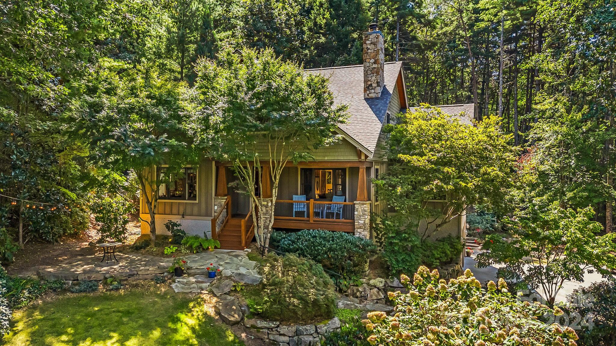 front view of a house with a tree