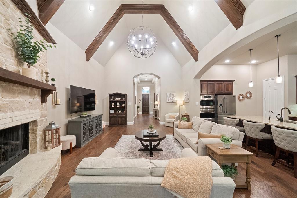 a living room with fireplace furniture and a flat screen tv