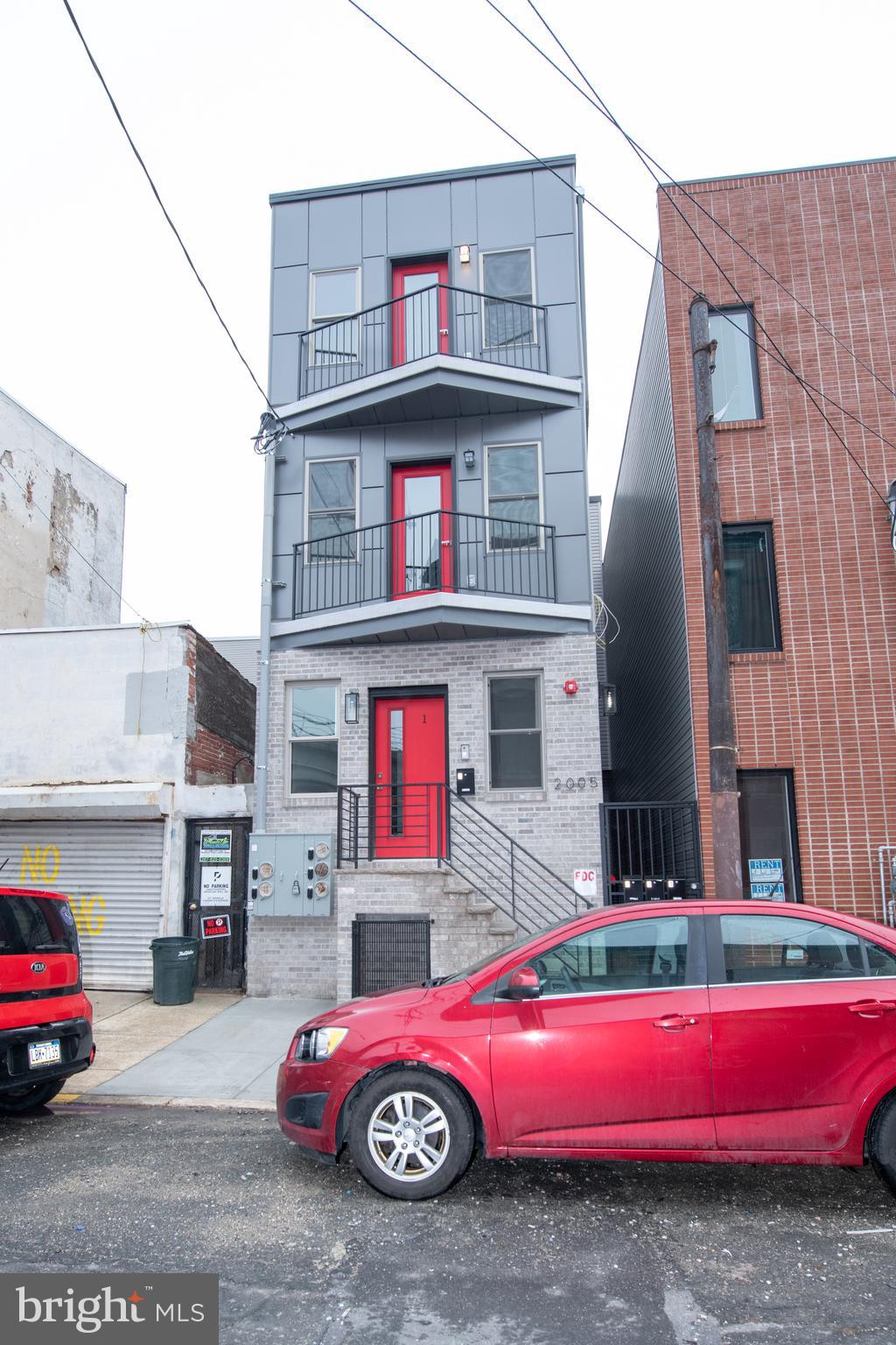 a car is parked in front of a building