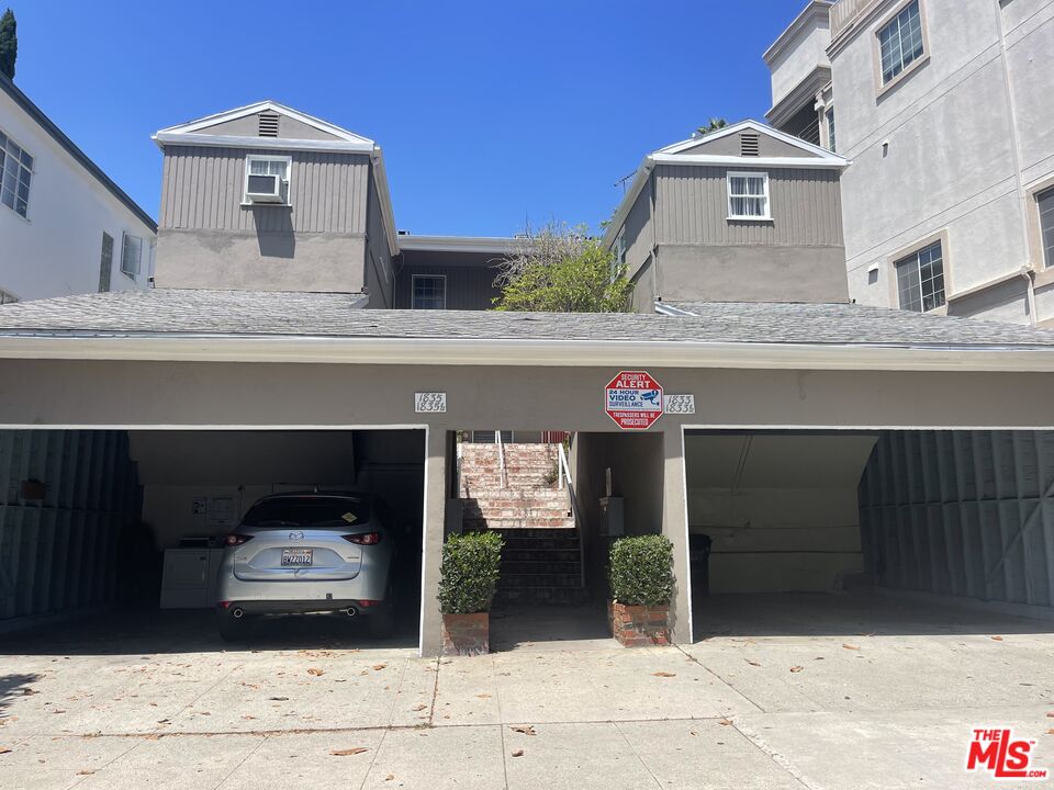 a front view of a house with a garage