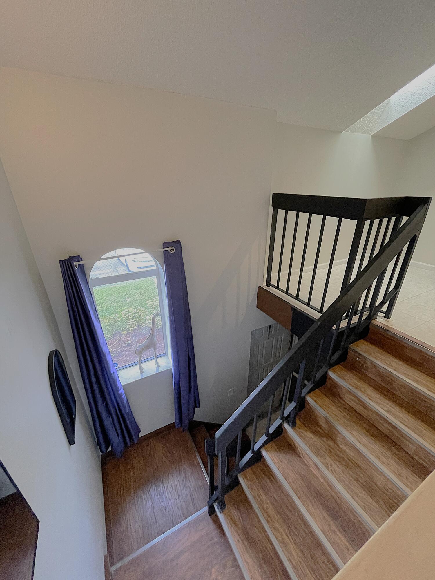 a view of staircase with lots of wooden floor