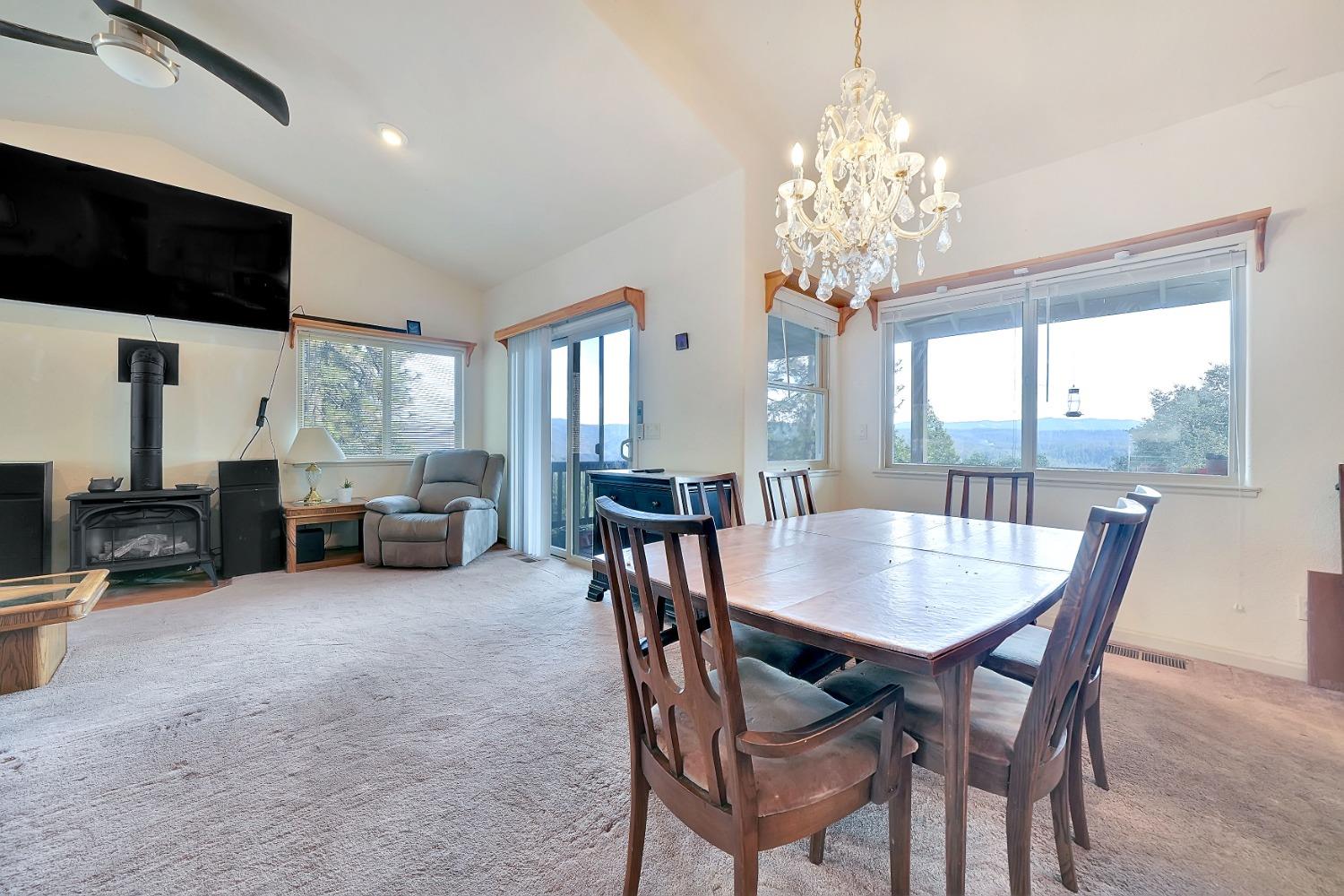 a view of a dining room with furniture window and outside view