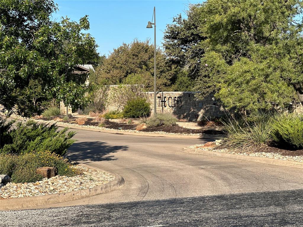 a view of a road with a building in the background