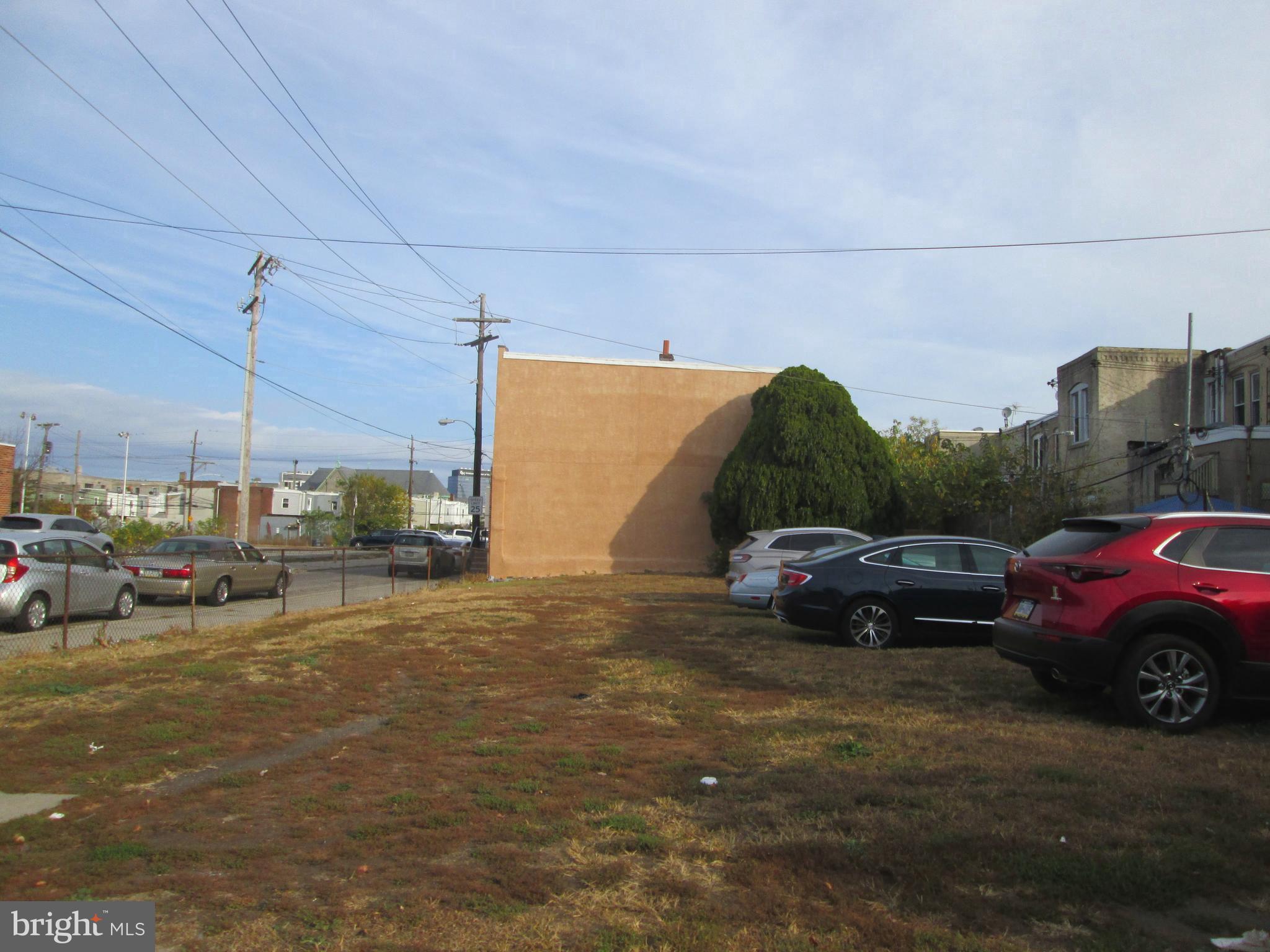 a view of street with parked cars