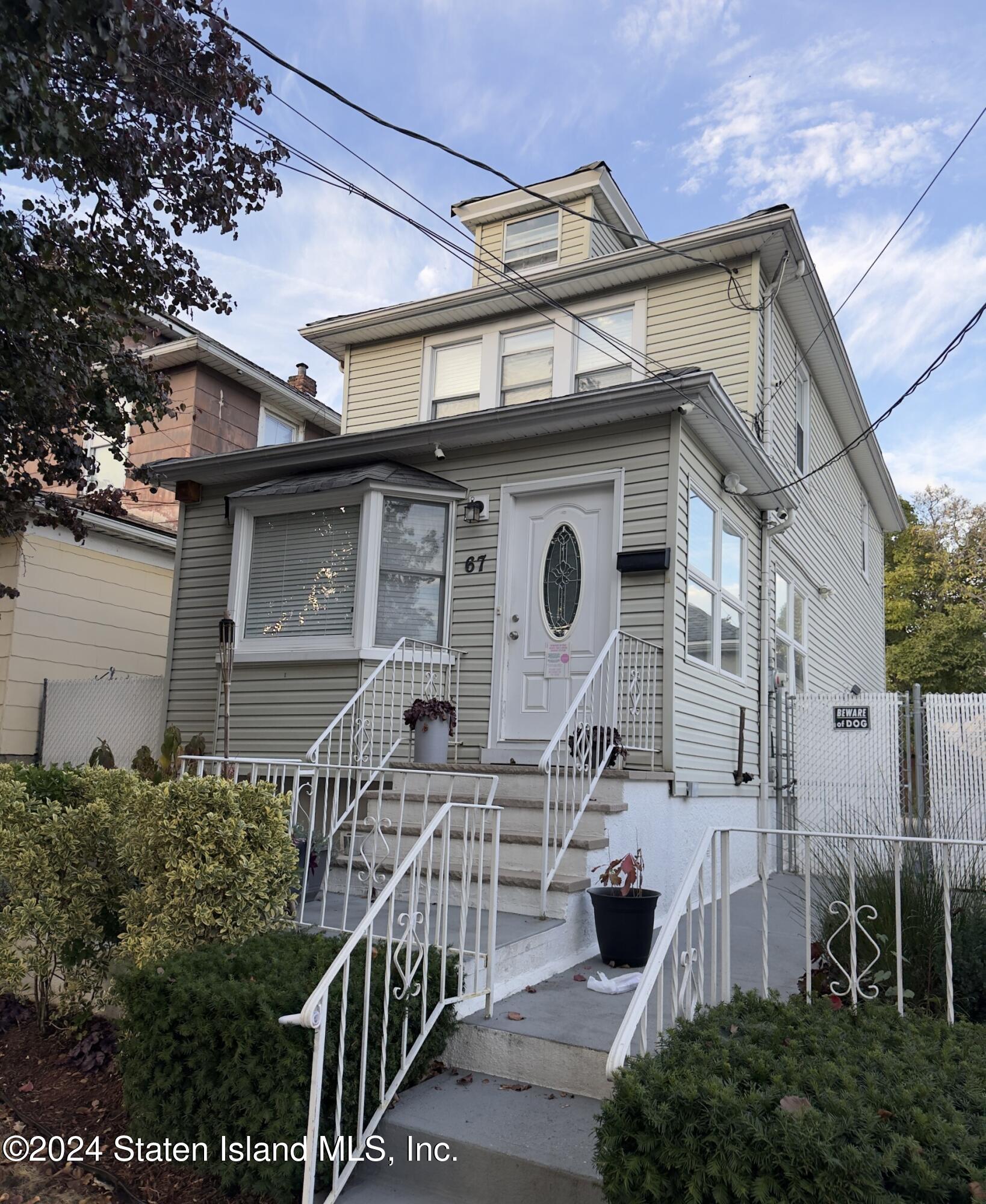 a front view of house along with street