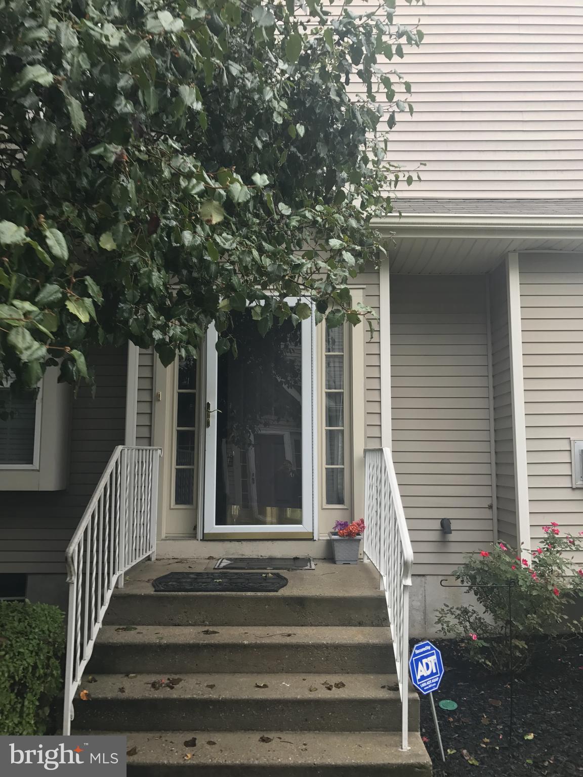 a view of a house with a iron stairs