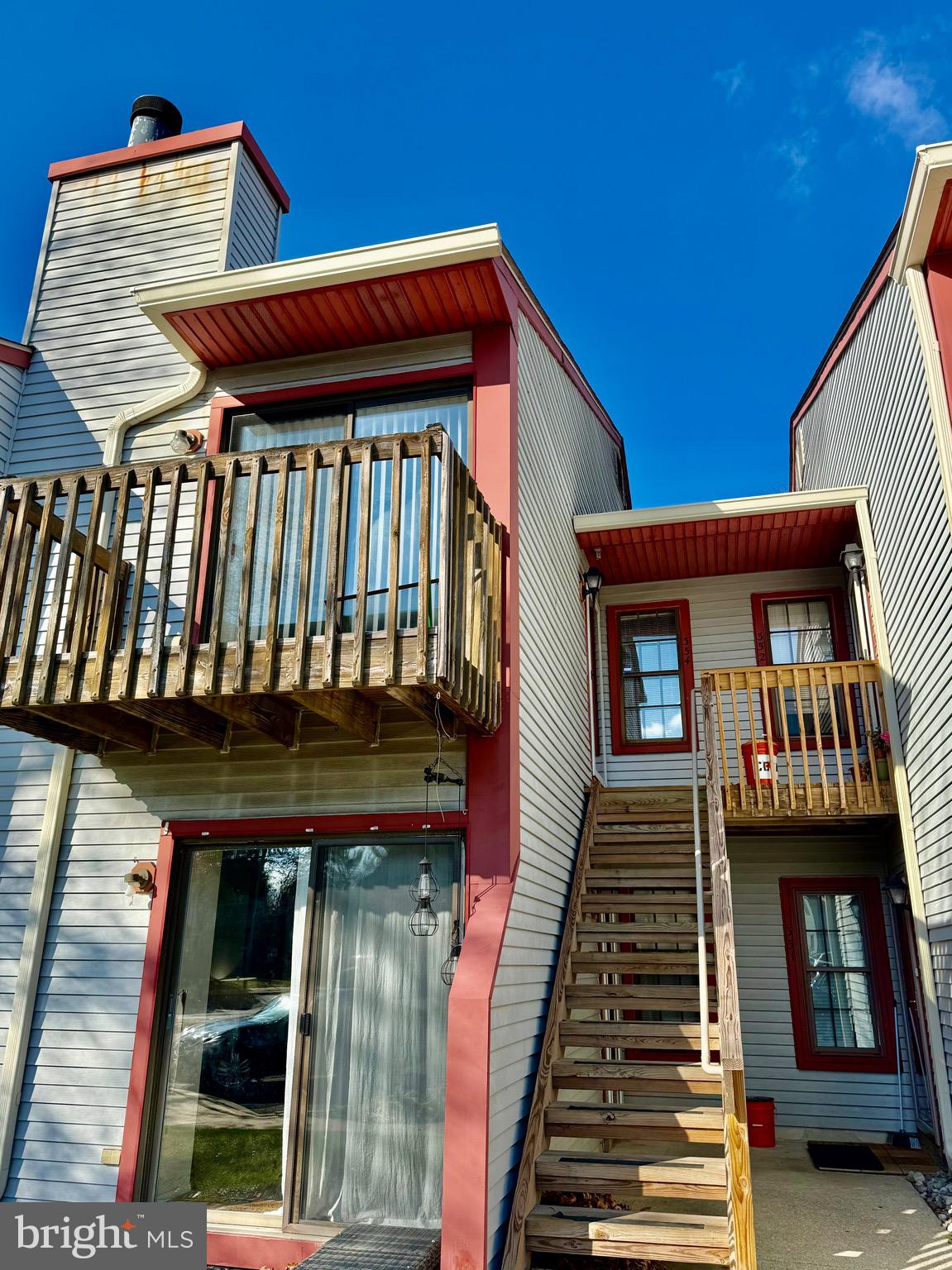 a view of a balcony with front door