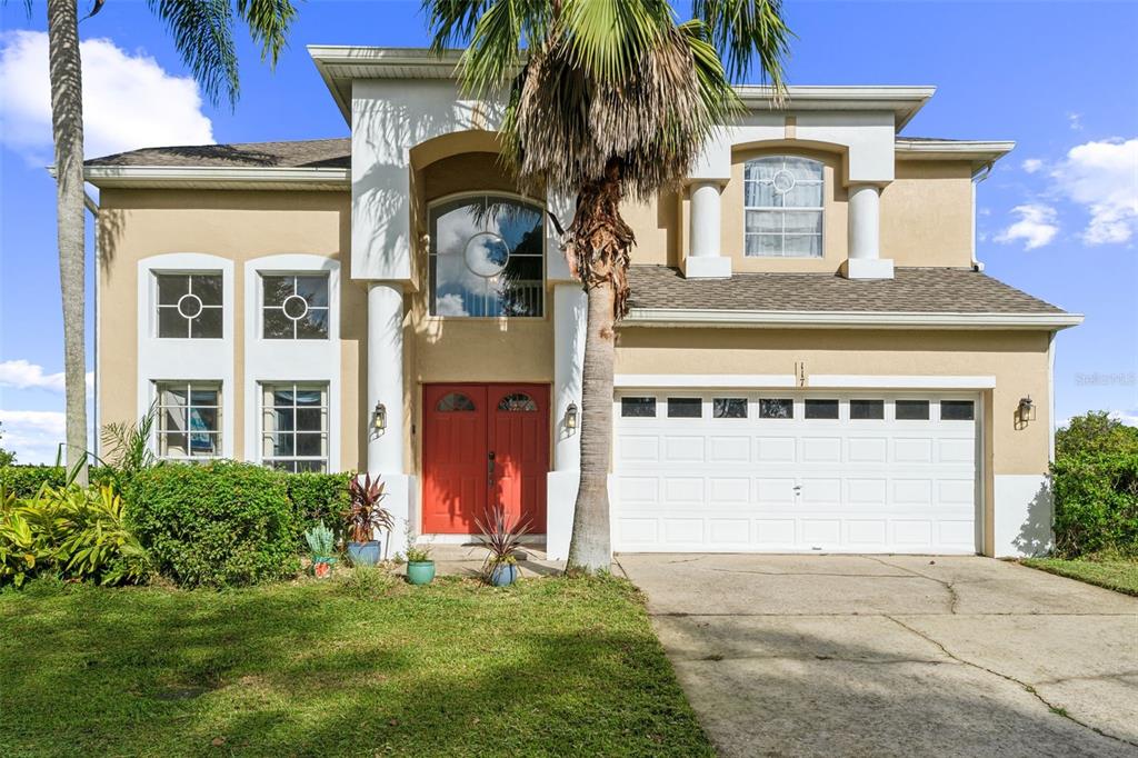 a front view of a house with a yard