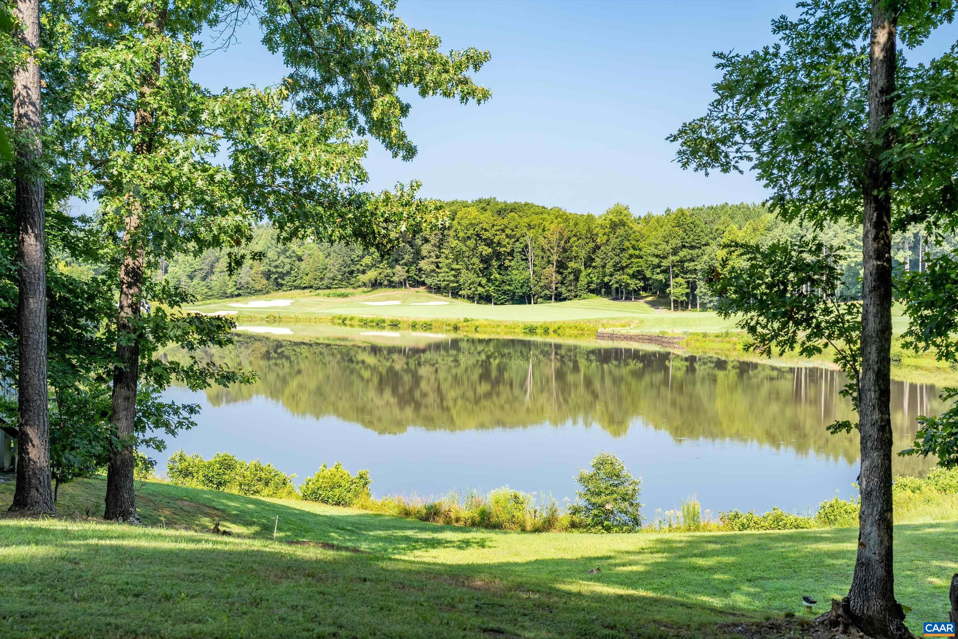 a view of a lake with a big yard