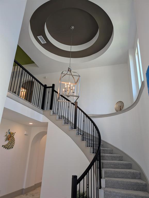 a floor to ceiling window and hardwood floor