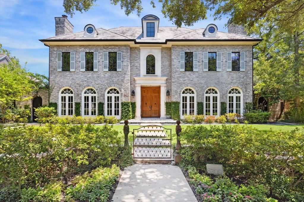 front view of a house with a garden