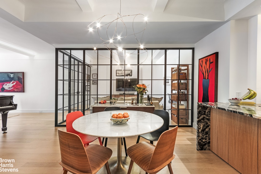 a view of a dining room with furniture and window