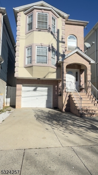 a front view of a house with parking