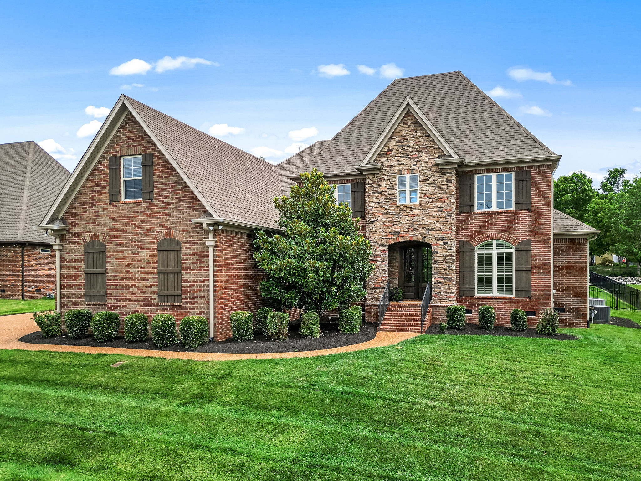 a front view of a house with a yard