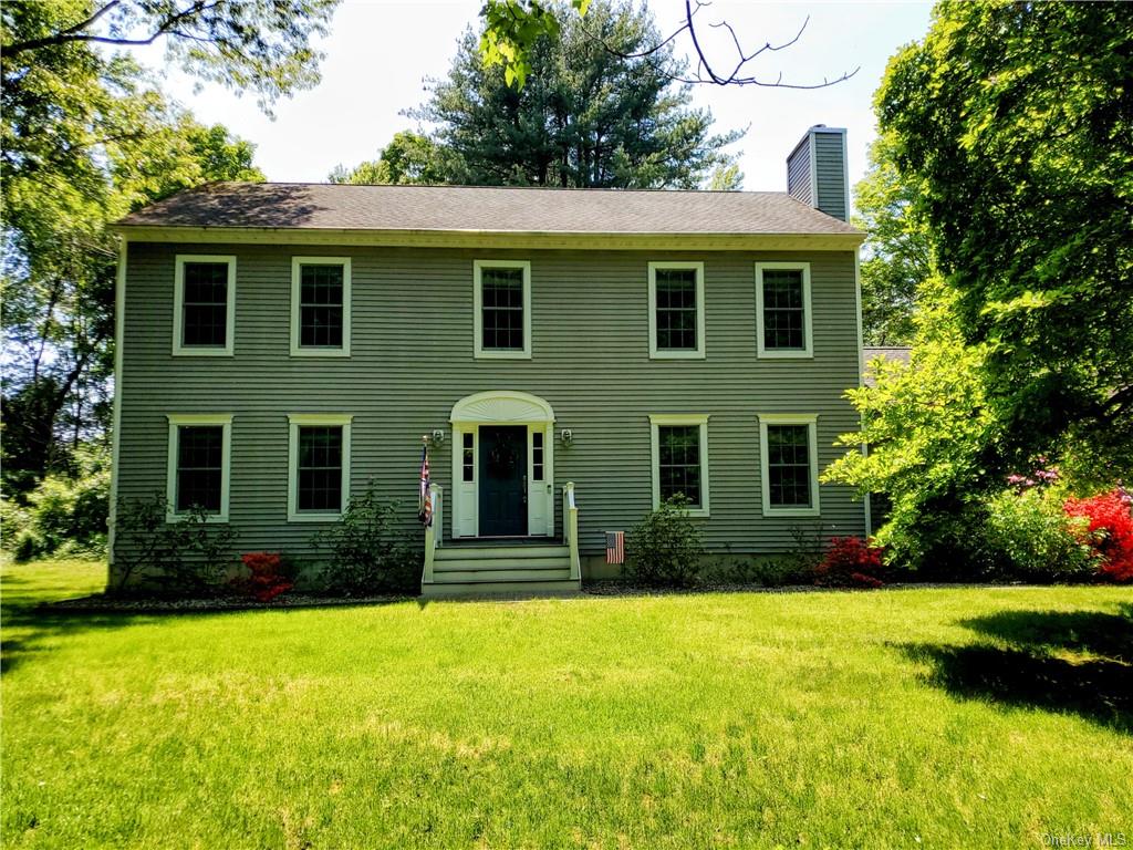 a view of a house with plants and garden