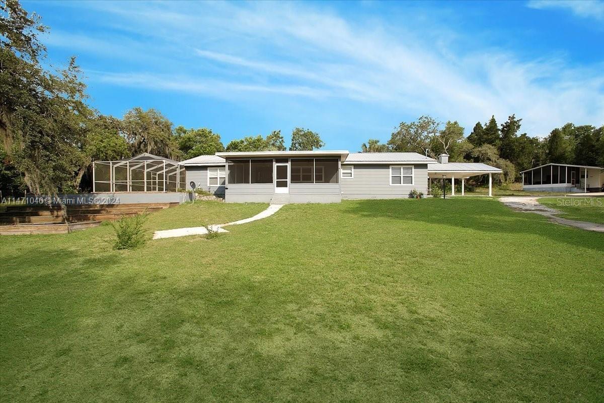 a view of a house with a big yard