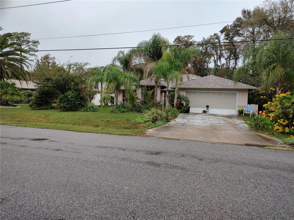 a view of a house with a street