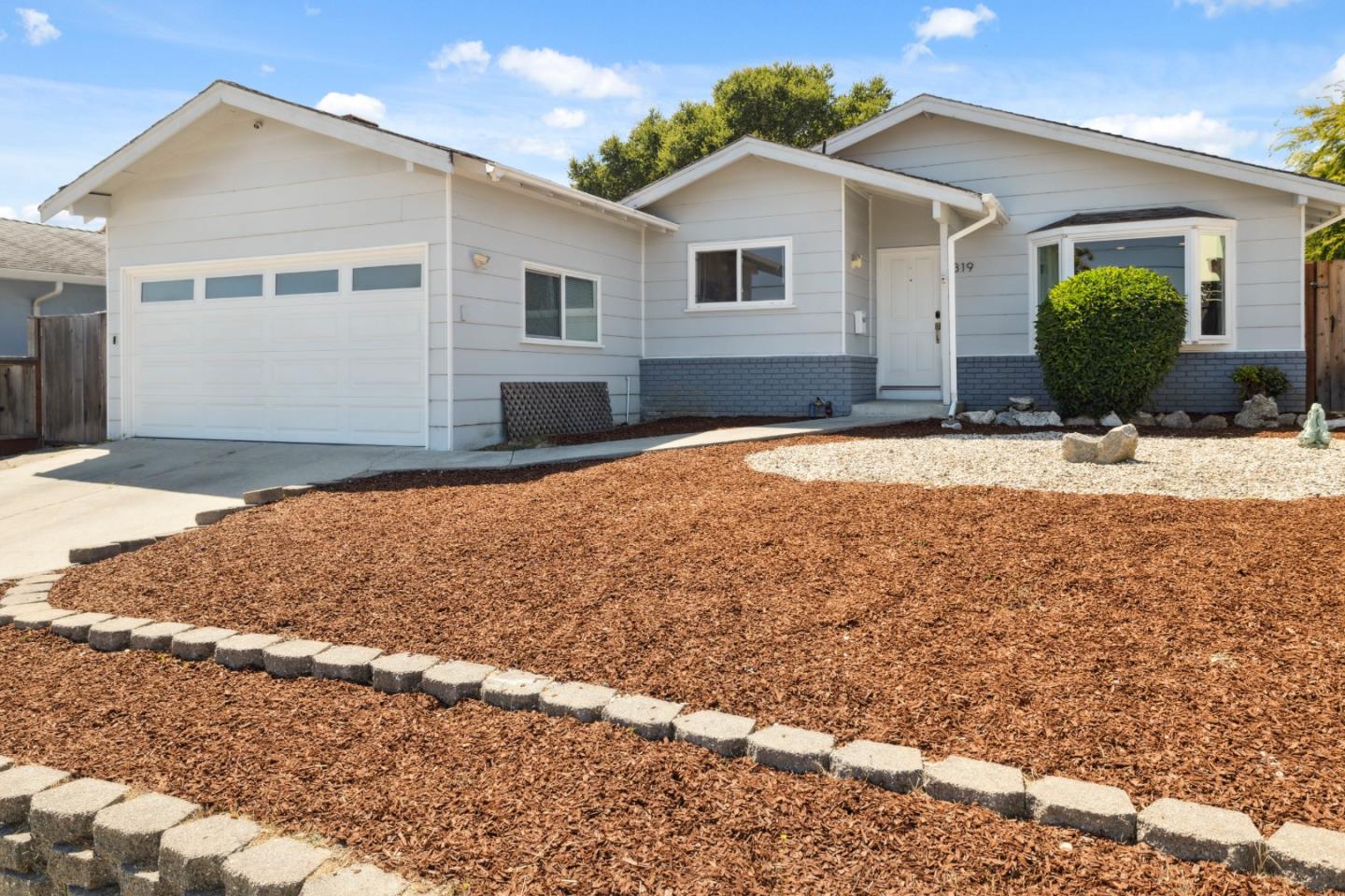 a front view of a house with a yard