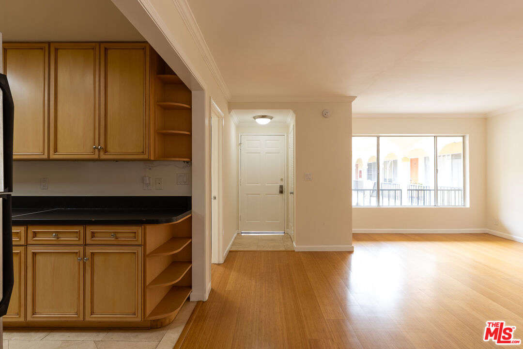 a view of hallway with wooden floor