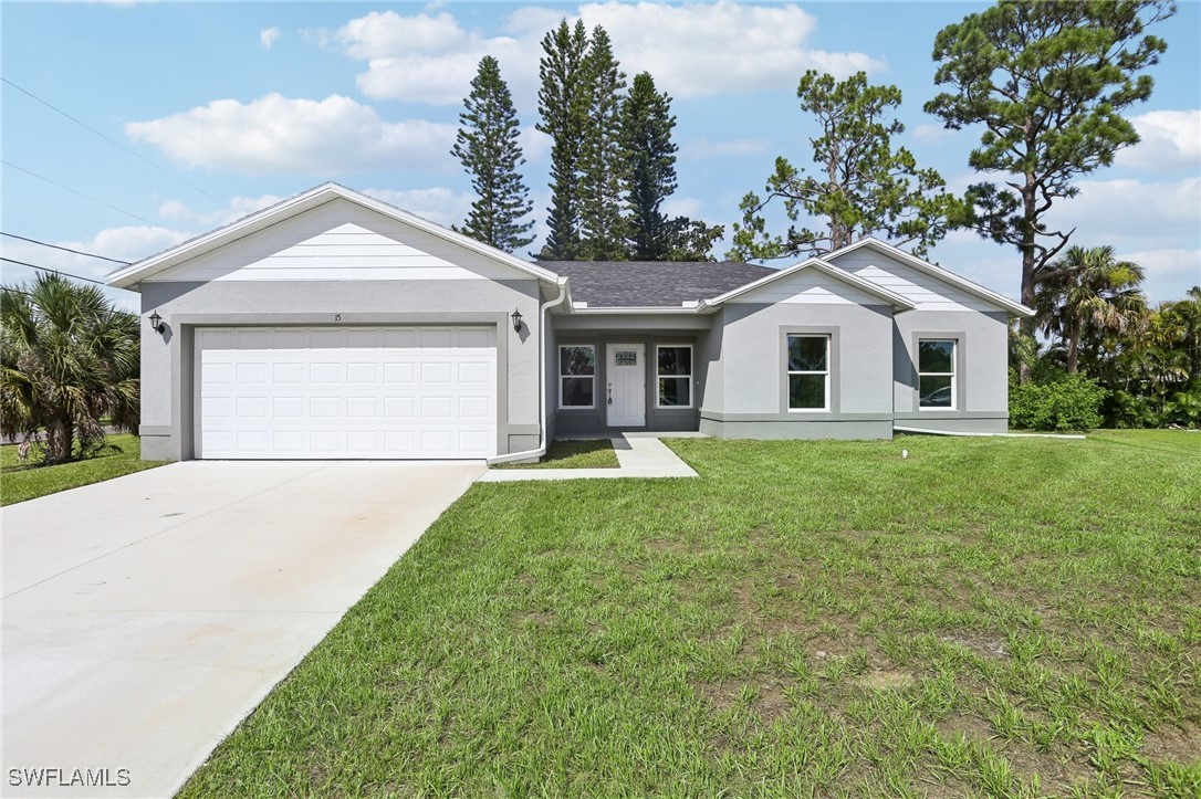 a front view of house with yard and green space