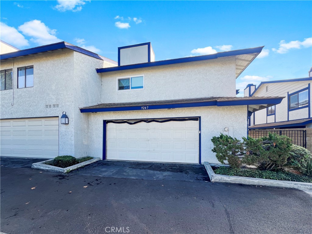 a front view of a house with a garage