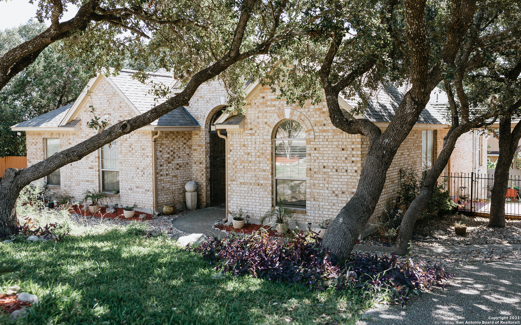 a view of a house with a yard and plants