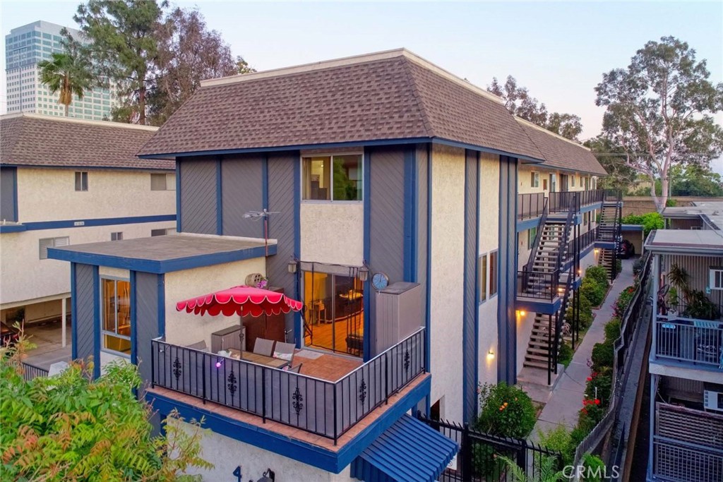 a view of a house with balcony and deck