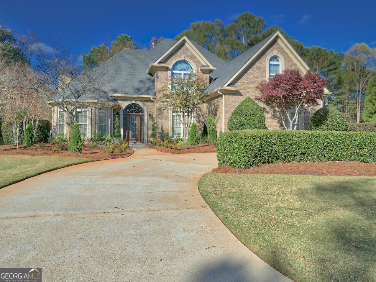 a front view of a house with a yard