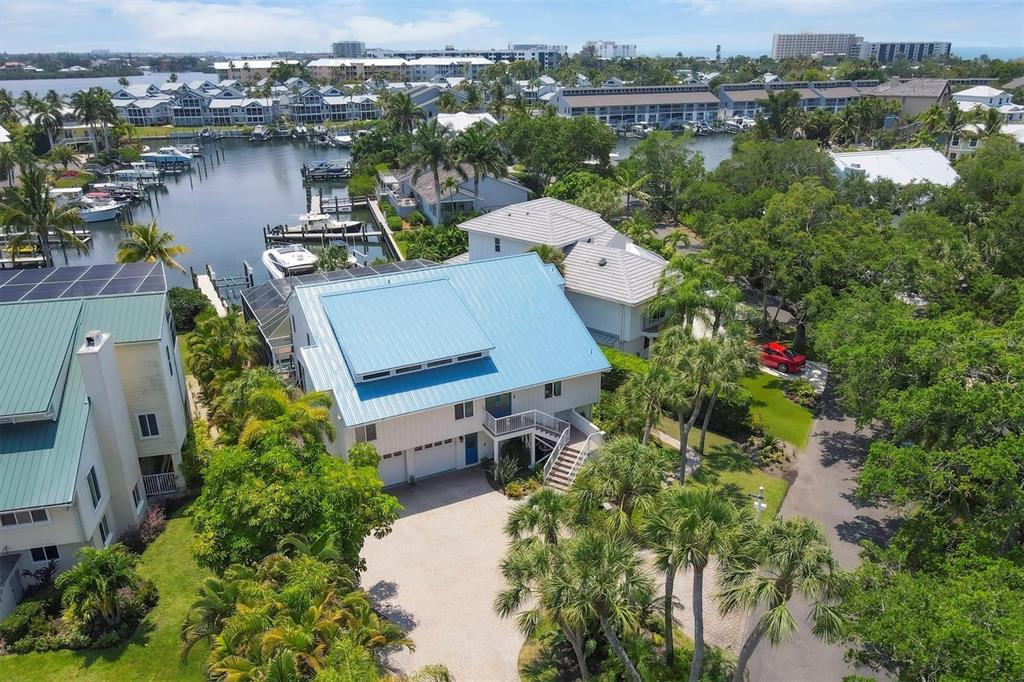 an aerial view of a house with a lake view