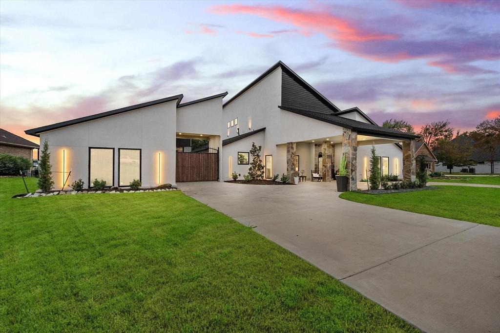 a view of house with yard and green space